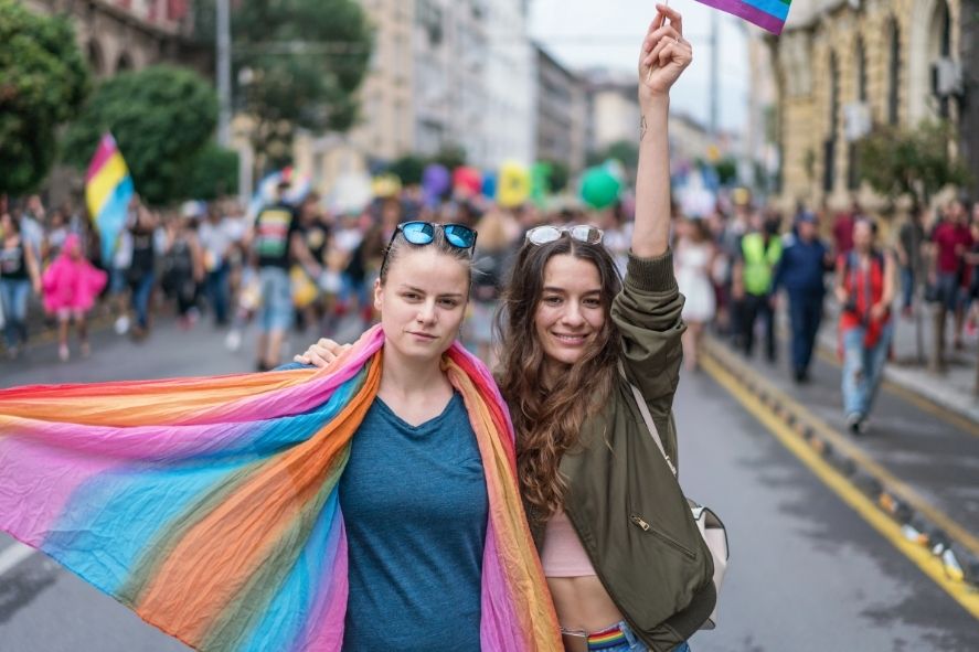 friends celebrating phuket pride in a lively street march